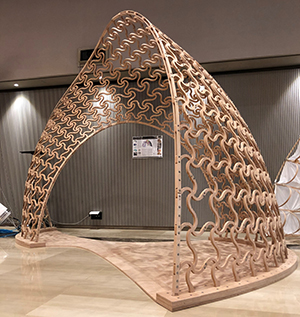 FlexMaps Pavilion: a twisted arc made of mesostructured flat flexible panels